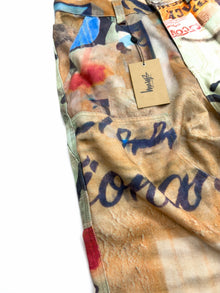 Calça Stüssy x Coursemys Patchwork Multicolor - detalhe de bolso e etiqueta